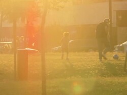 MS TS SLO MO Shot of family playing football at sunset / Buenos Aires, Argentina Stock Footage
