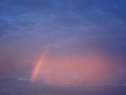 Rainbow in the evening sky time lapse Stock Footage