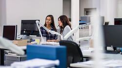 Two industrial designer women discussing project at office Stock Footage