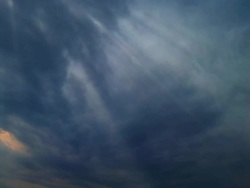 Storm cloudscape with sunbeams - time lapse, NTSC Stock Footage