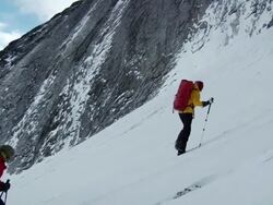 MS ZI ZO T hikers heading up steep snow slope and Hikers have heavy winter clothes and backpacks / Namche,Namche Valley,Nepal Stock Footage