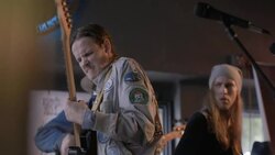 Passionate guitarist shreds and slams guitar as song ends at rock concert Stock Footage