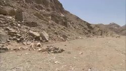 Rubble surrounds the ruinous entrance and excavation site of the Sikait emerald mines in Egypt. Stock Footage