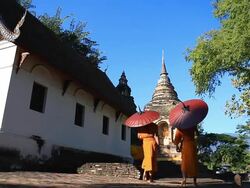 HD:Two monk walking with temple background.. Stock Footage