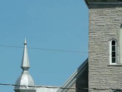 The facade of a church with a statue in the window Stock Footage