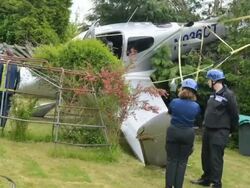 Cirrus Aircraft Crash Lands In To A Garden In Chel Stock Footage