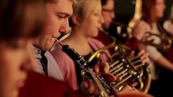 Clarinet player in orchestra struggles with clarinet Stock Footage