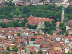 MS AERIAL Shot of houses and running vehicle on road way at Arnstadt / Germany Stock Footage