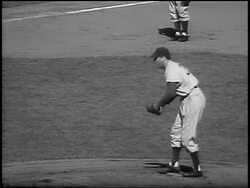 B/W 1956 PROFILE Brooklyn Dodger Sal Maglie preparing to pitch in World Series / NYC Stock Footage