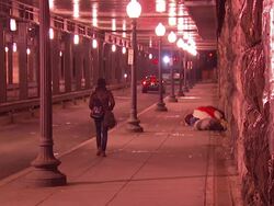 Homeless person sleeping on a freezing night News Clip