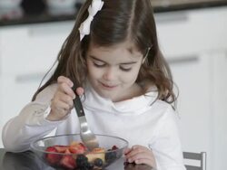 Caucasian girl eating fruit salad Stock Footage