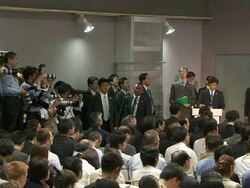 MS TU Shot of photographers taking pictures with news reporters at press conference during G8 meeting / Hokkaido Toyako, Japan Stock Footage
