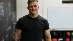 Confident muscular man smiling in gym Stock Footage