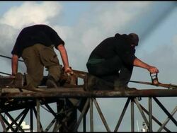 Highwire: Men Work Rigging Crane Stock Footage