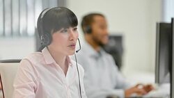 DS Female Asian helpline operator greeting the client over phone Stock Footage