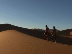 Bush people on namib dunes Stock Footage