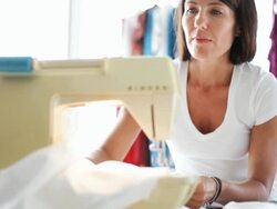 Entrepreneur fashion designer sewing machine Stock Footage