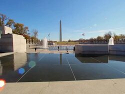 A static shot of the WWII Memorial with the Washington Monument in the distance. Stock Footage