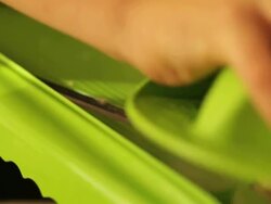 Boy slicing ginger Stock Footage