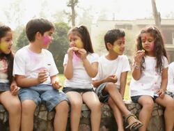 Group of kids eating gujia in holi festivals Stock Footage