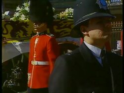 September 6, 1997 FILM MONTAGE MS Princess Margaret, Queen Elizabeth, and Princess Anne watching the funeral procession for Princess Diana/ MS Procession passing family in front of Buckingham Palace/ HA WS Procession leaving palace/ London, England/ AUDIO Stock Footage