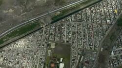 Leaving the city of Chimalhuacan then crossing the blue green waters of Lake Nabor Carrillo in the Valley of Mexico. Stock Footage