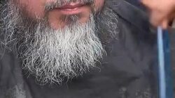 CLEAN : Artist Ai Weiwei gets a haircut at Idomeni migrant camp News Clip