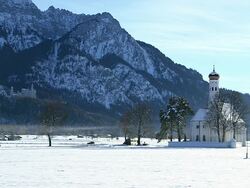 WS View of church St. Coloman near Schwangau in winter / Schwangau, Bavaria, Germany Stock Footage
