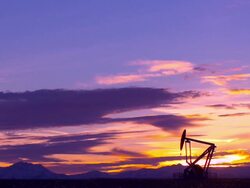 HD: Pump Jack Silhouette Against Dramatic Sky Stock Footage