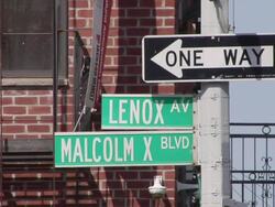 MS One way signs and Lenox Av and Malcolm X Blvd street signs / New York, United States Stock Footage