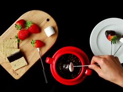 MS Hands coating marshmallow with melted chocolate / Seoul, South Korea Stock Footage