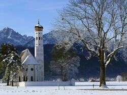 WS View of church St. Coloman near Schwangau in winter / Schwangau, Bavaria, Germany Stock Footage