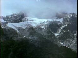 WA High angle view across snowy mountain ridge, foggy horizon, Uganda Stock Footage