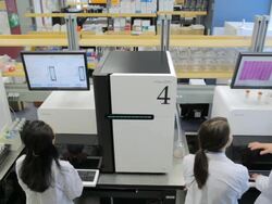 MS POV Lab technicians working on HiSeq2000s DNA sequencers / Vancouver, BC, Canada Stock Footage