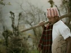 People of Nepal: Happy manual worker with pickaxe and container. Stock Footage