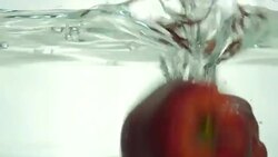 Apple drop in the water. Close up. Slow motion. Stock Footage