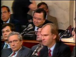 July, 1987 Senator Daniel Inouye talking into microphone during Iran-Contra hearings Stock Footage