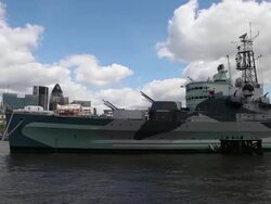 HMS Belfast on the river Thames, London Stock Footage