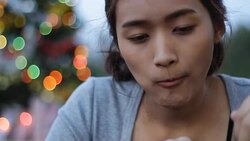 eating dinner with Christmas light outdoor Stock Footage