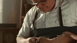 HD DOLLY: Traditional Shoemaker Finishing The Outsole Stock Footage