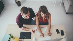 Interior designers pointing at colour charts Stock Footage