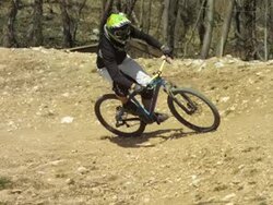 HD Super Slow-Mo: Biker Racing Along Trail Stock Footage