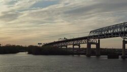 Aerial floating over the Delaware River alongside the Betsy Ross Bridge Stock Footage