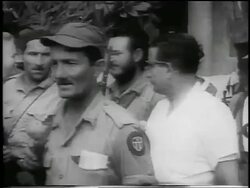B/W 1959 line of guerrilla soldiers carrying guns walking past camera outdoors / Cuba / newsreel Stock Footage