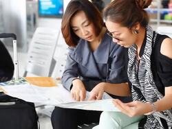 HD:Two Asian women looking the map. Stock Footage