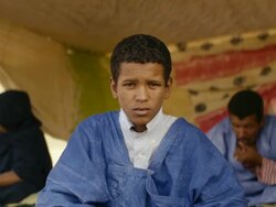 Portrait of Mauritanian boy sitting in his tent Stock Footage
