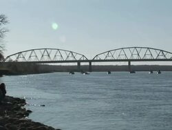 WS Specators watching  from boat collapsin  steel bridge  into river / Bismarck, North Dakota, USA Stock Footage