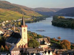 HA Church located in valley town by river / Lorch, Hess, Germany Stock Footage