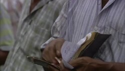 A shopper pays for  food at a market in India. Stock Footage