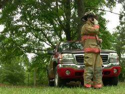 Fireman talks on his radio Stock Footage